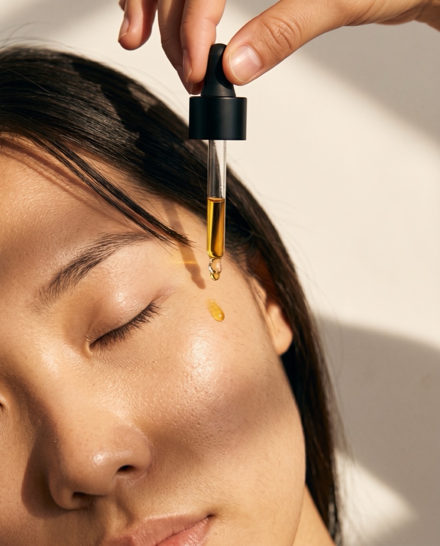 Oil on a cheekbone, East Asian woman